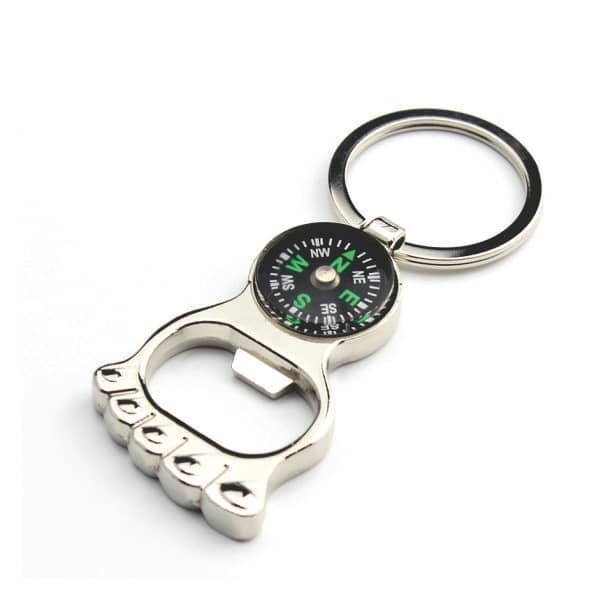 Chaveiro em formato de abridor de garrafa com bússola